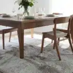 Why A Rug Under The Dining Table Causes A Specific Problem Most People Don’T Expect